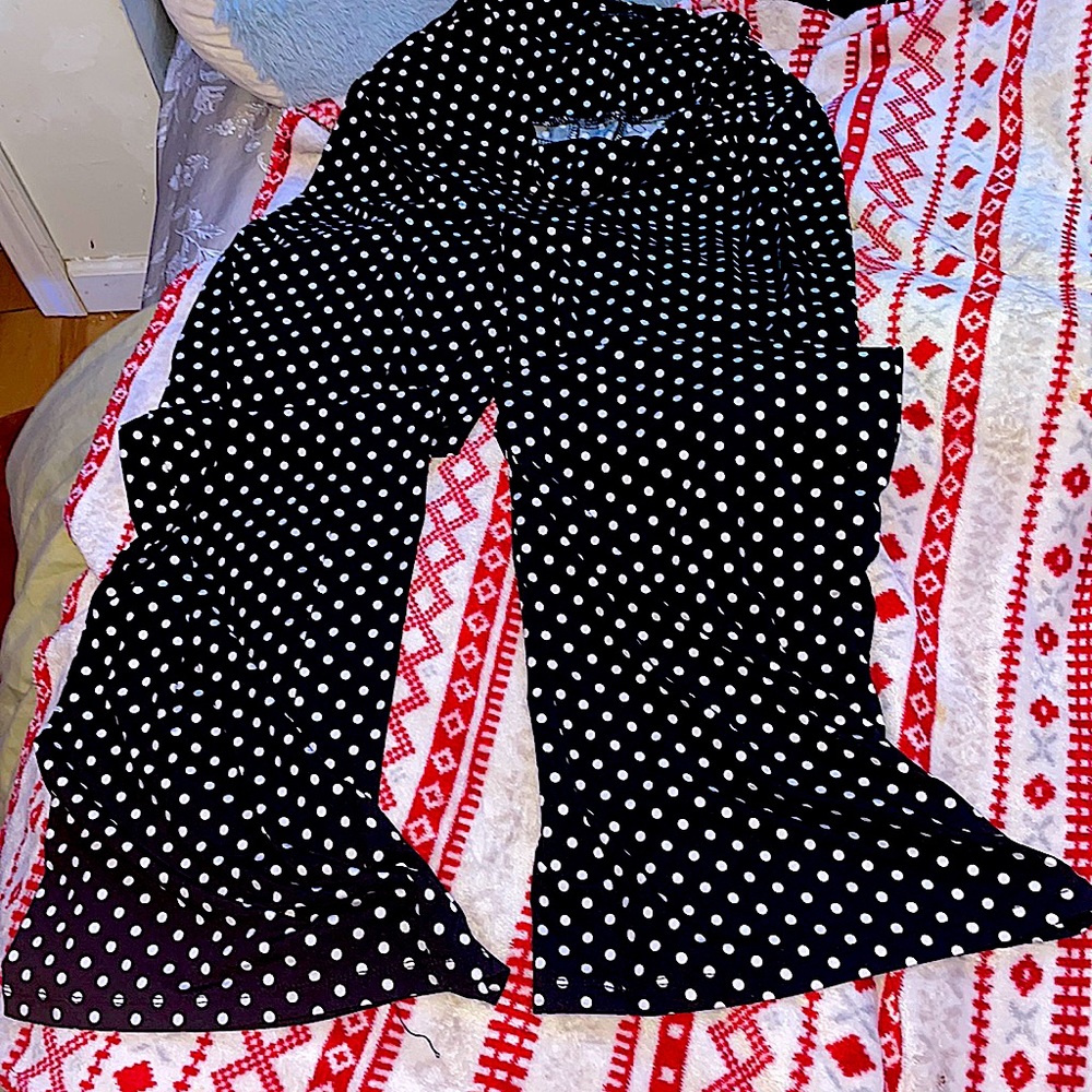 The brand is Arolina and the size is large. Polkadot black and white.